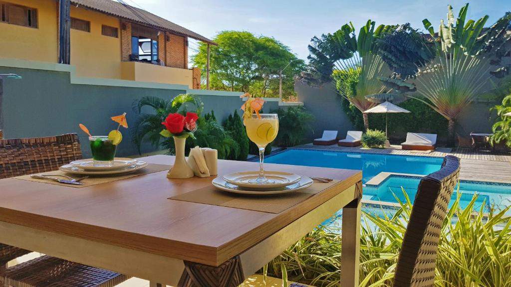 Poolside breakfast table at Ravenala Hotel Boutique, Canoa Quebrada